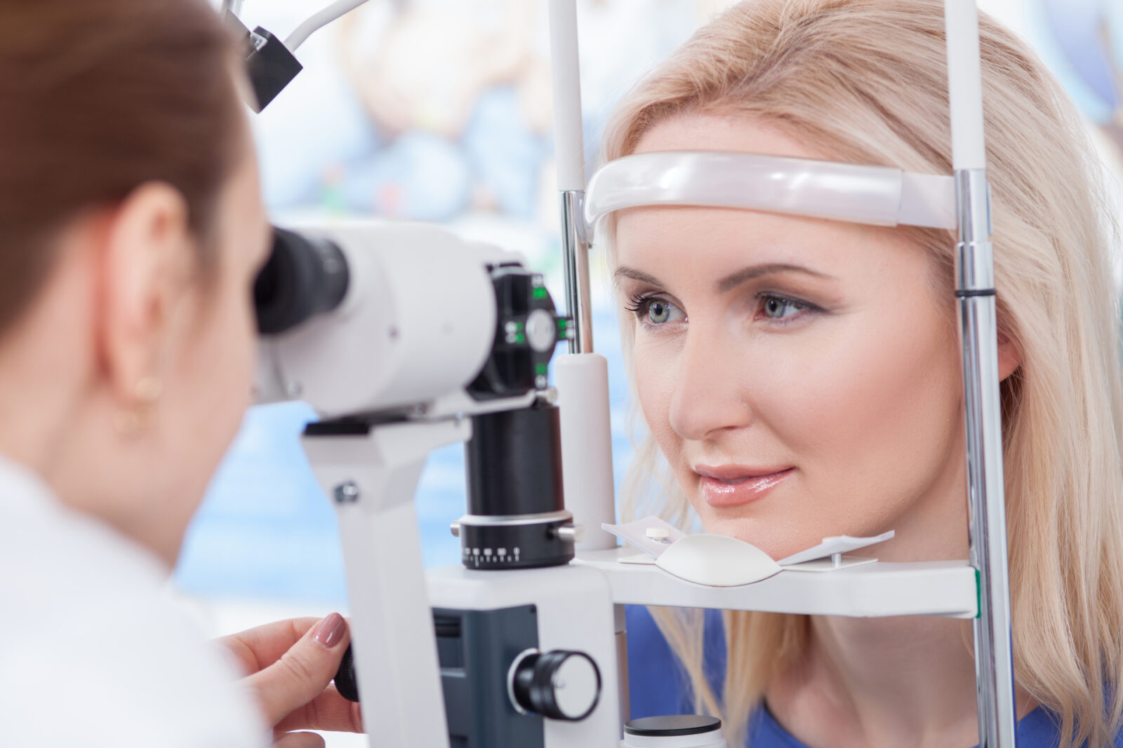 Professional oculist is checking human vision