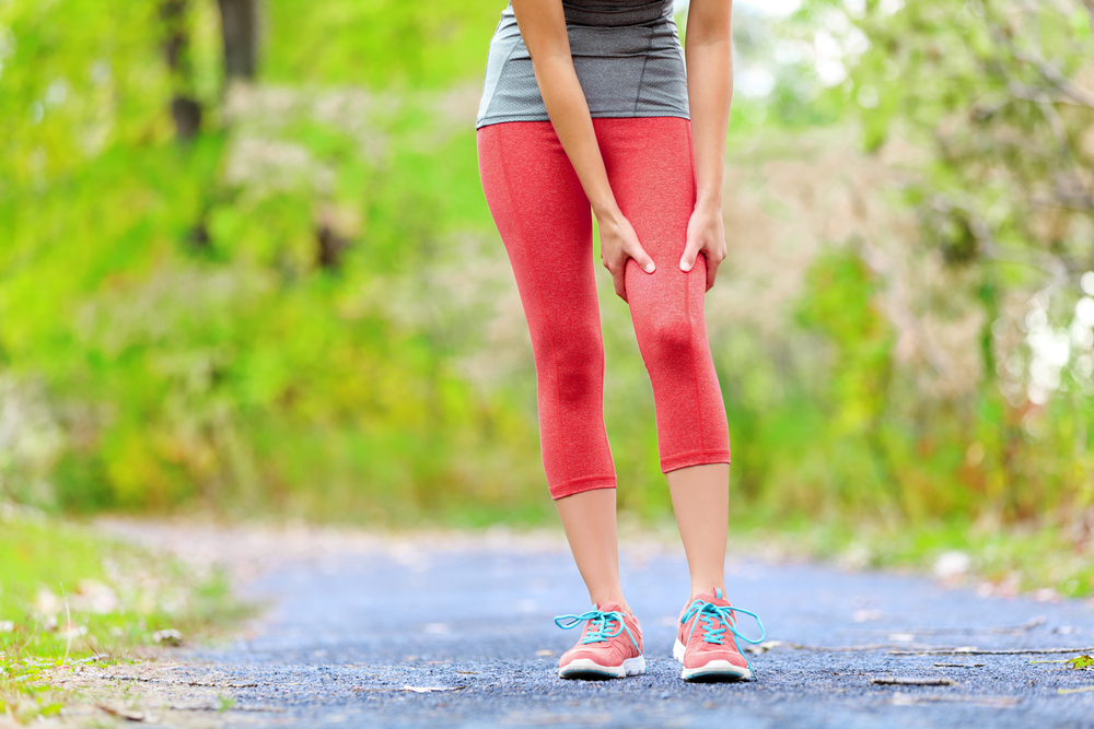 woman runner side cramps after running