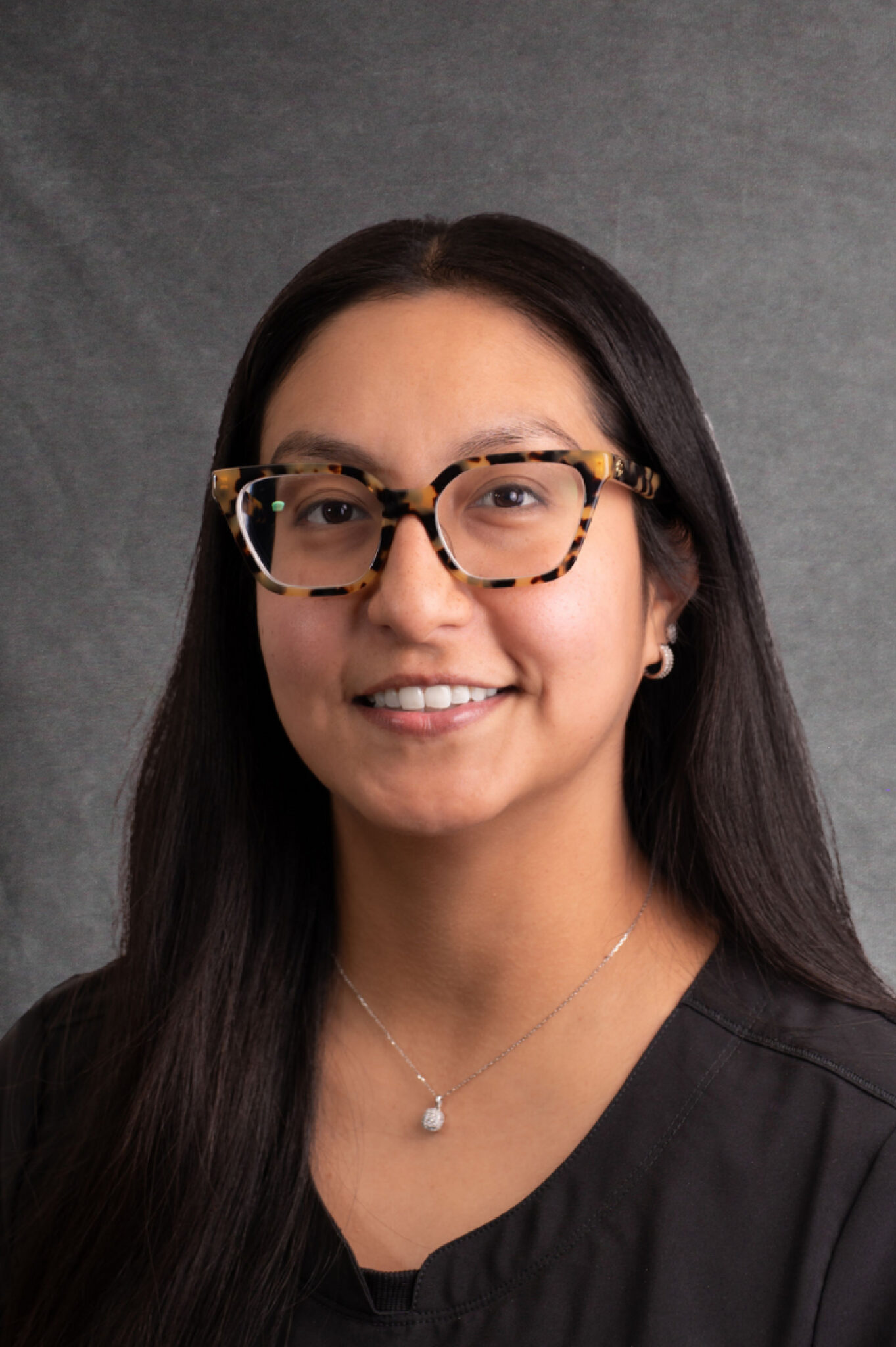 Woman with glasses, young, office manager Estero Bay Dental