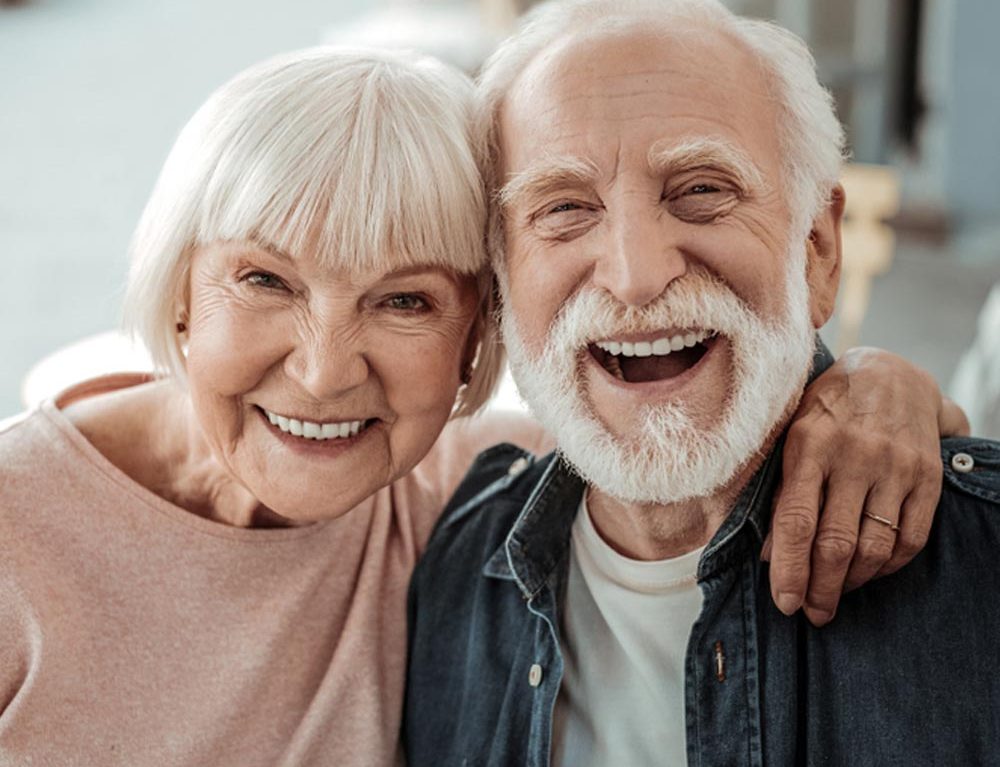 Joyful nice elderly couple smiling