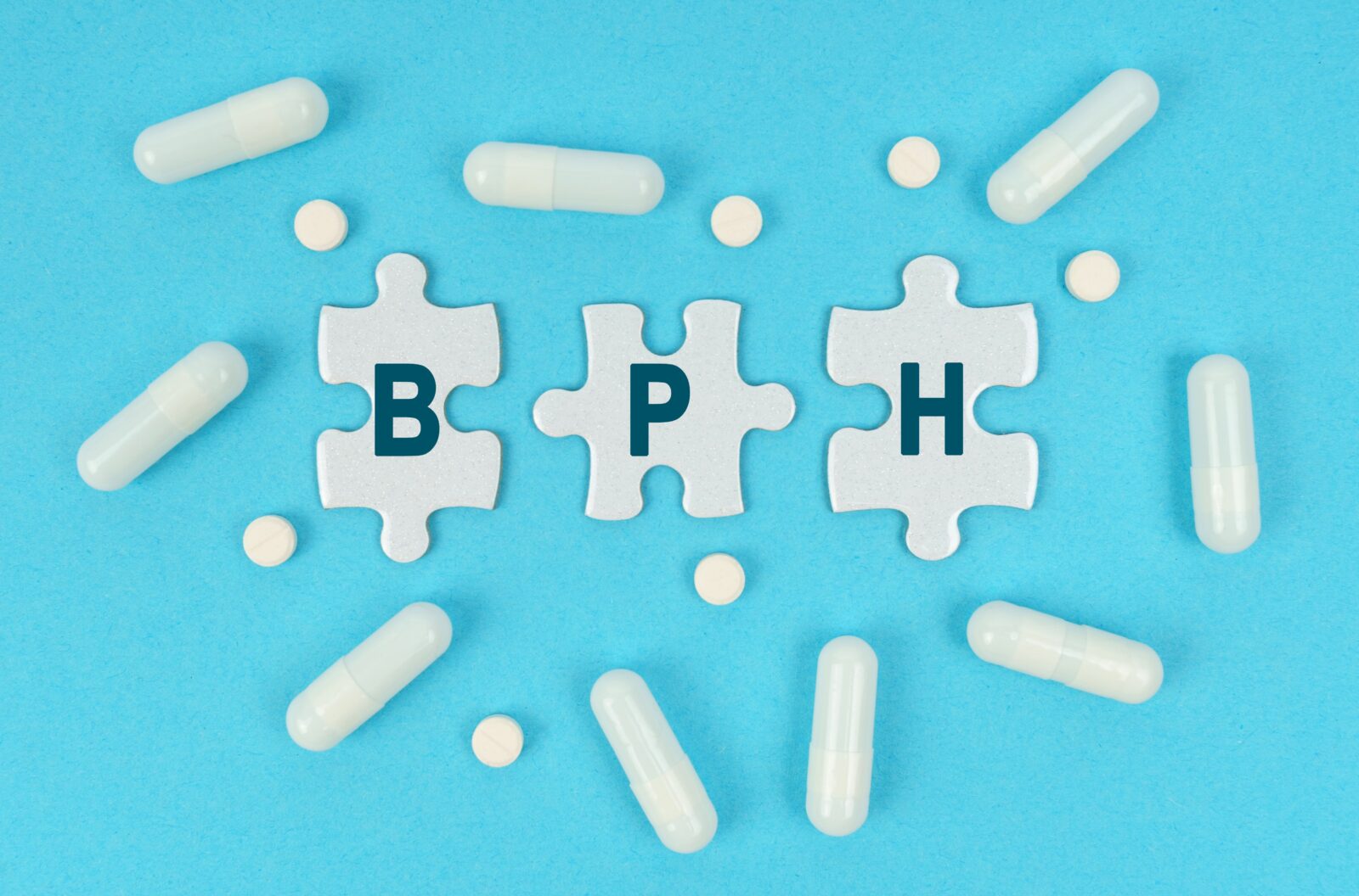 Medicine and health. On a blue background, there are pills and puzzles with the inscription - BPH
