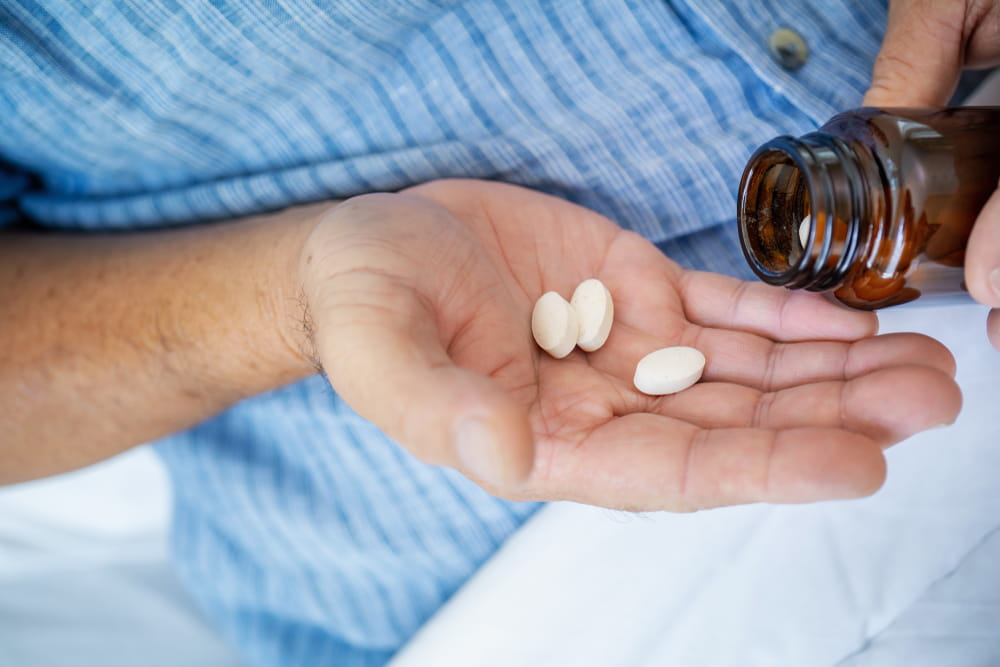 Senior man taking drugs, Mature man with supplements pill.