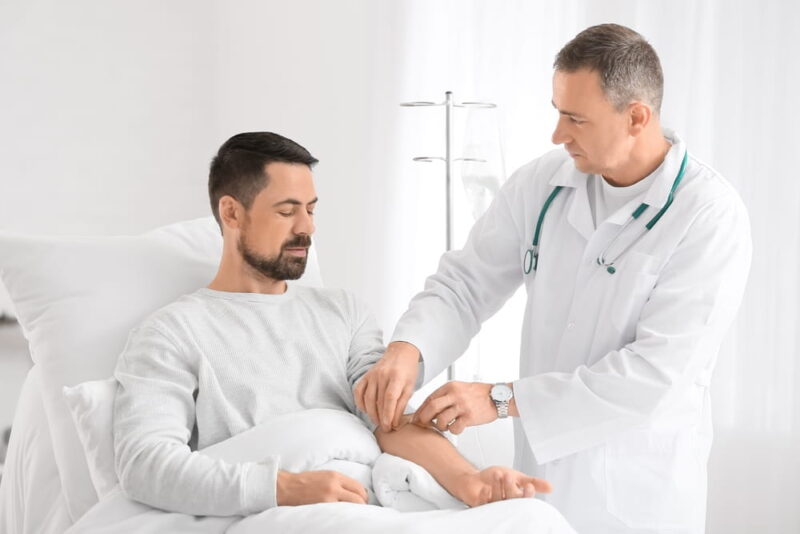 Man undergoing course of chemotherapy in clinic. Prostate cancer awareness concept