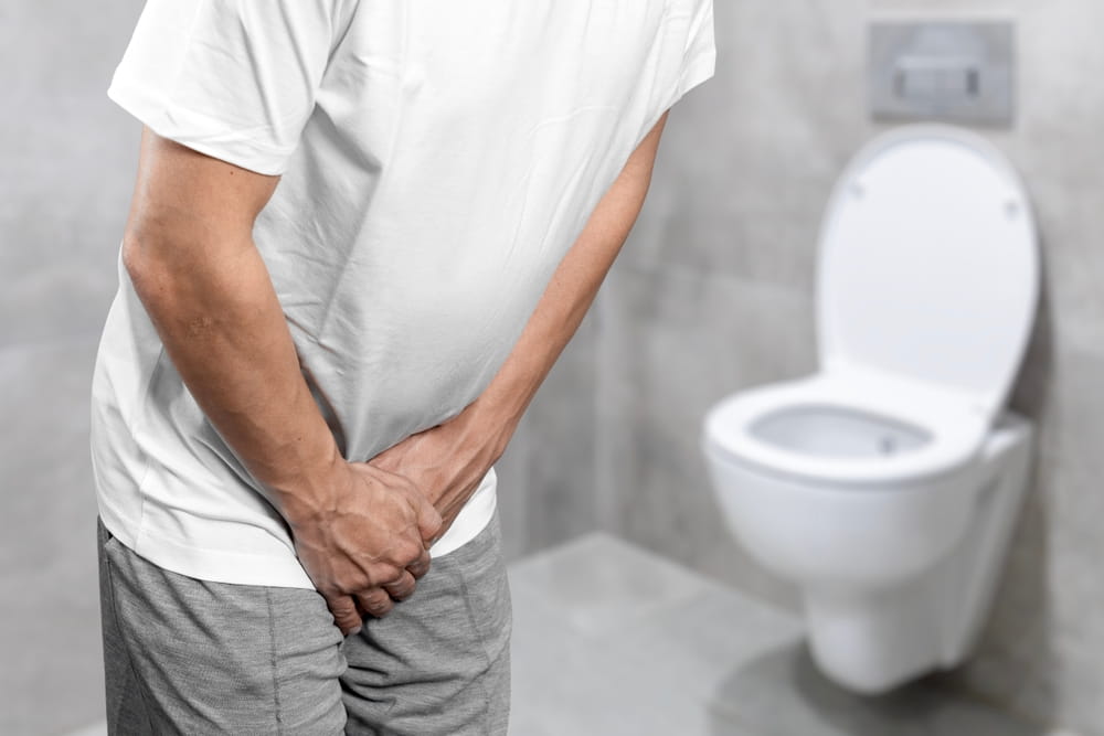 Person with urinary problems, Medical problem urinary incontinence. people with crotch pain, Man with hands on crotch with urinary problems