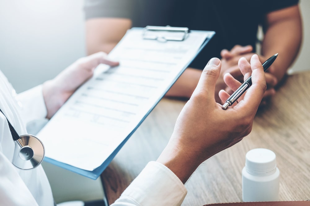 Doctors and patients sit and talk