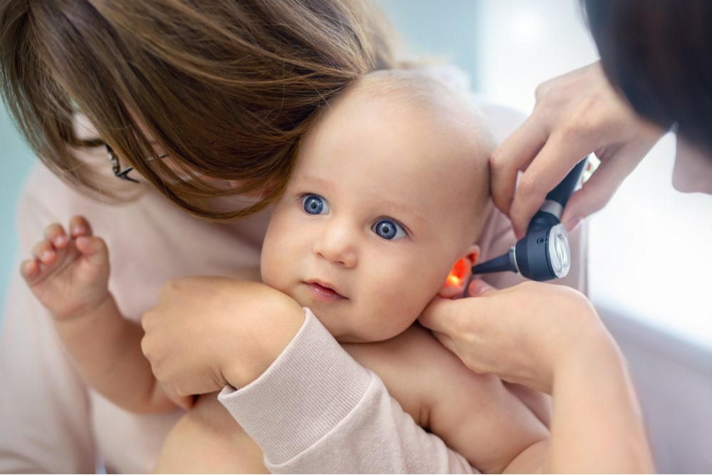 Pediatrist examining Childs ear