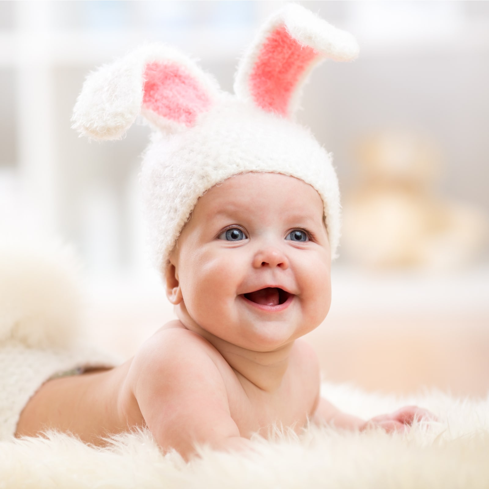 Smiling cute baby child in rabbit costum