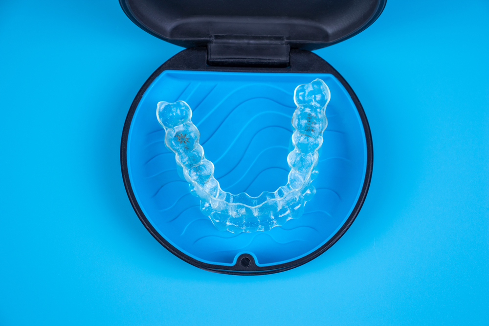An invisalign retainer in it's case