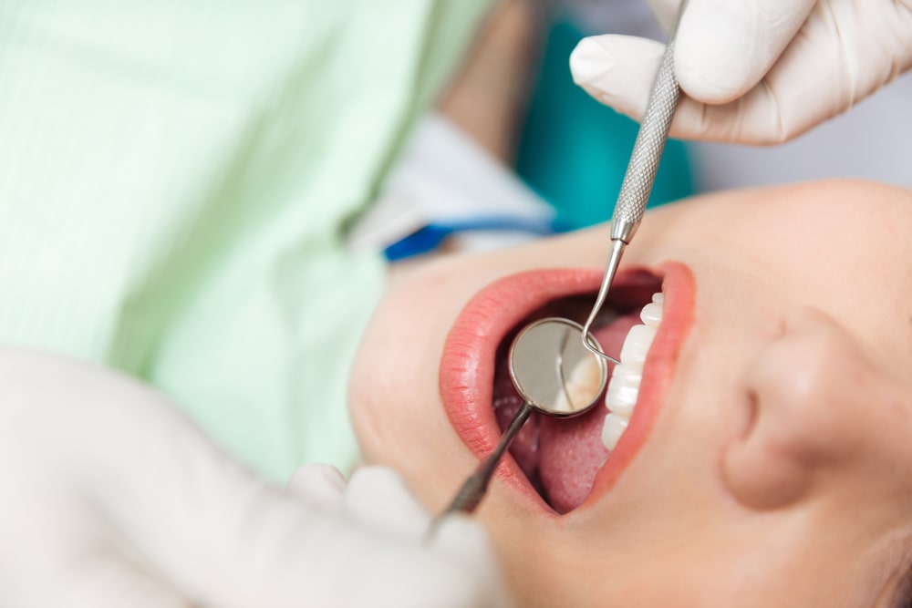 dental mirror in patient's mouth