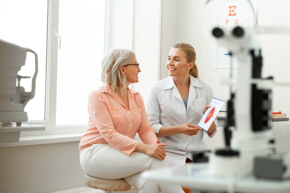 woman having appointment with older patient and discussing her issues