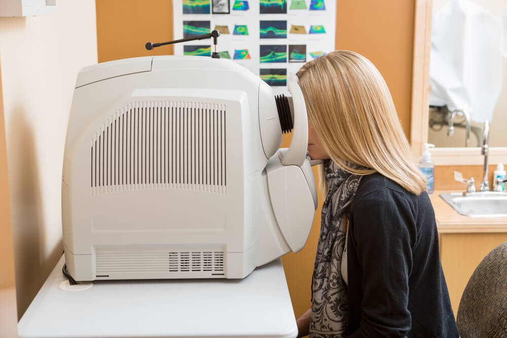 female patient going through eye examination in clinic