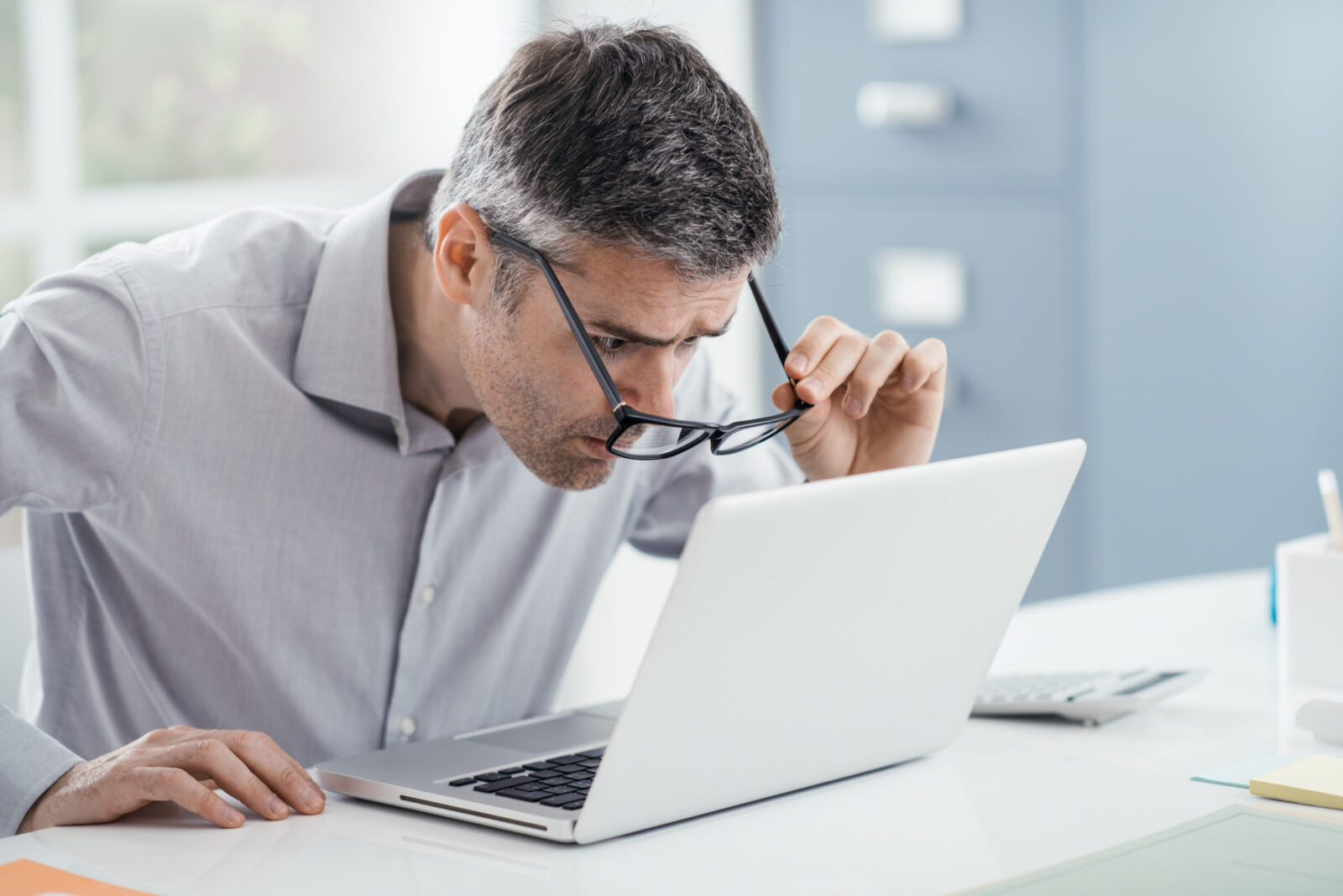 man working at office desk