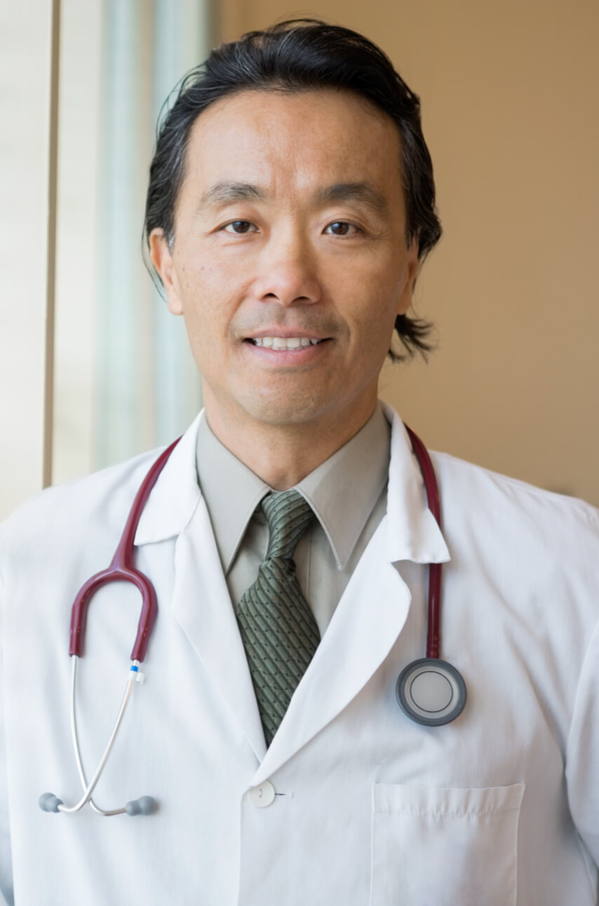 Asian male doctor with stethoscope around neck
