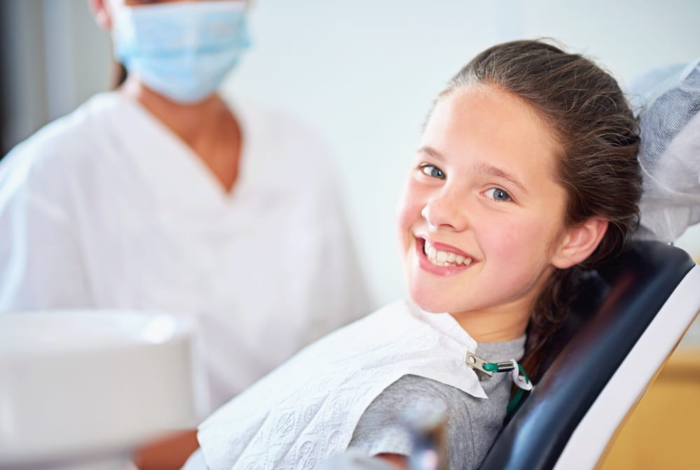 Dental, smile or portrait of girl with dentist in consultation room for mouth, gum or wellness