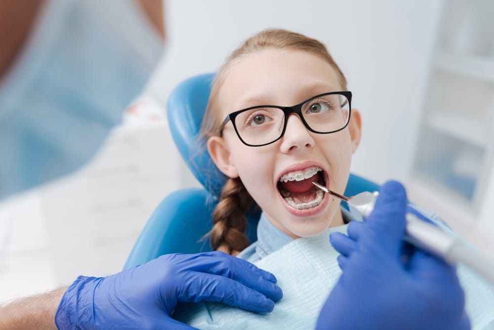 Cute admirable child sitting with her mouth open