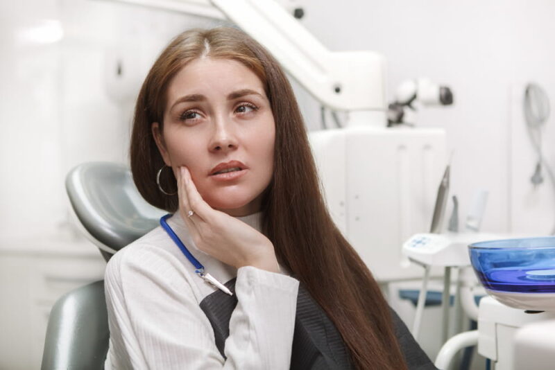 Blogs 1 used to demonstrate the concept of Blogs Close up of a woman suffering from toothache, sitting in dental chair at the clinic