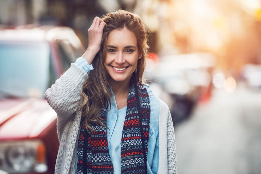 Happy young adult woman smiling