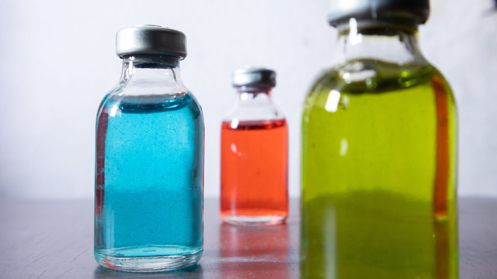 The stack of drug vial with colored solution