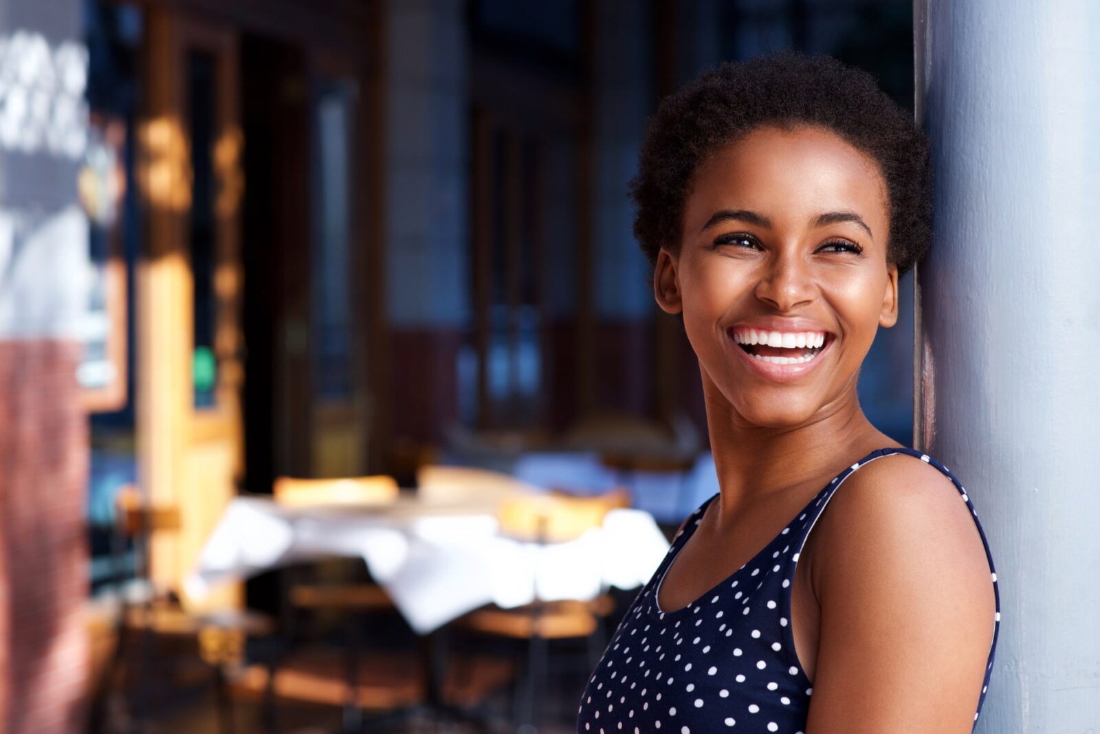 Side portrait of smiling young black woman