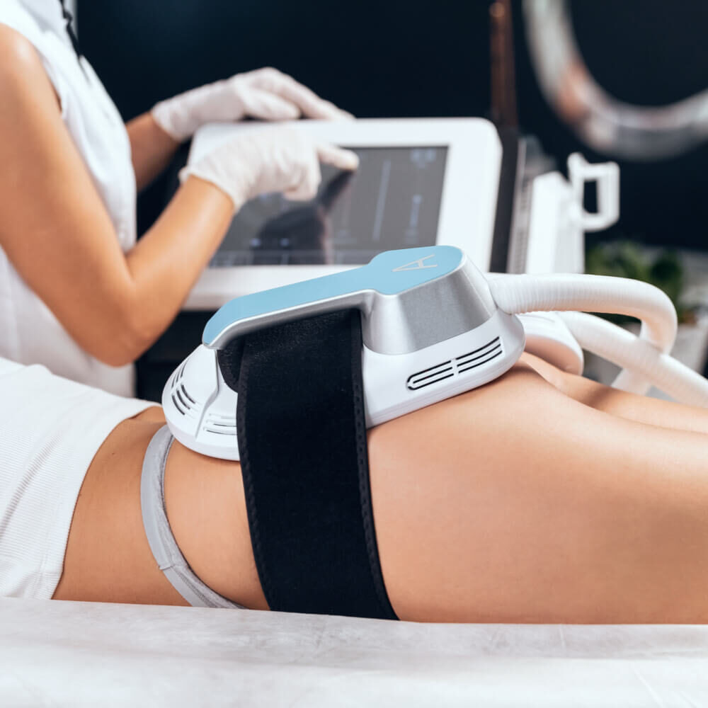 Close-up of woman lying receiving epilation laser treatment