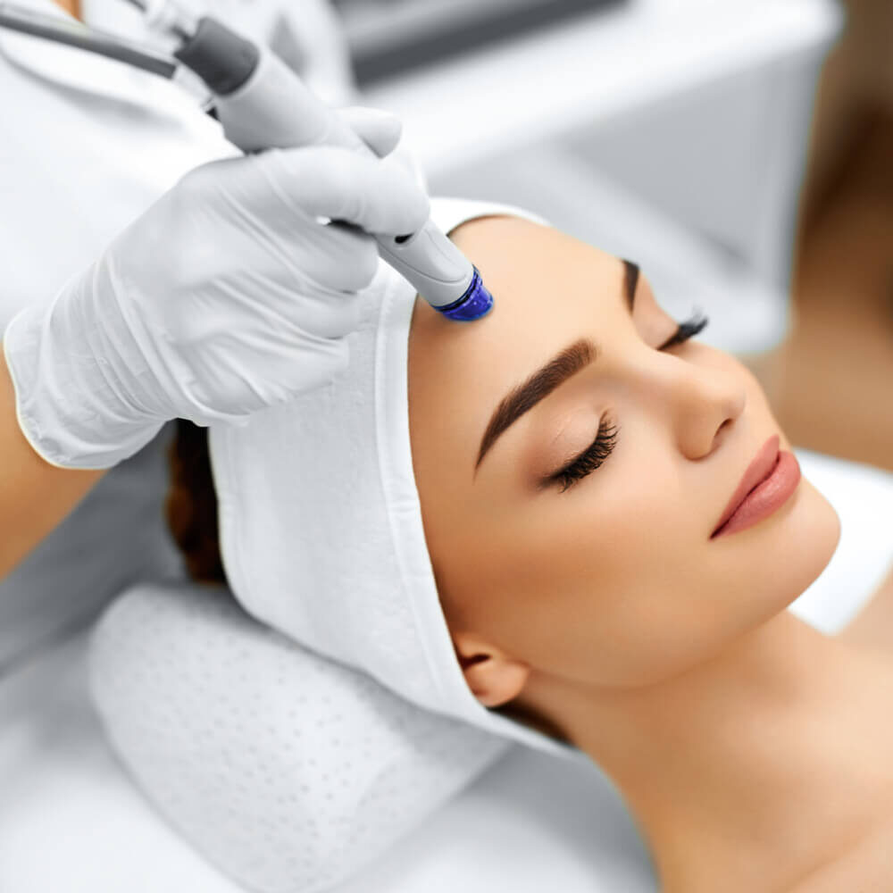 Close-up Of Woman Getting Facial Hydro Microdermabrasion Peeling Treatment