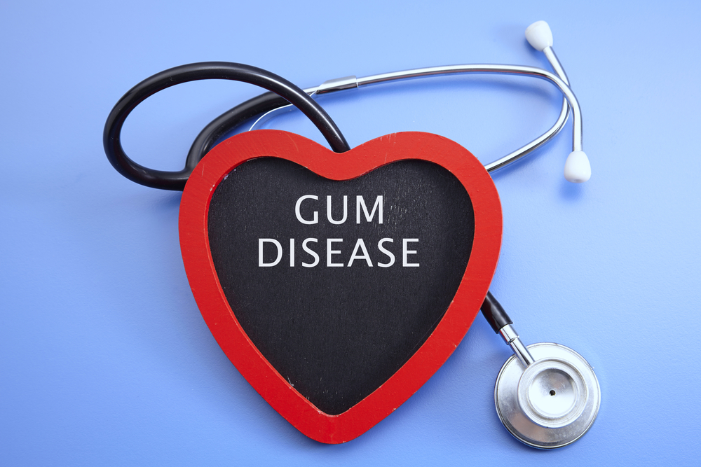 Stethoscope and red love with medical conceptual text-gum disease