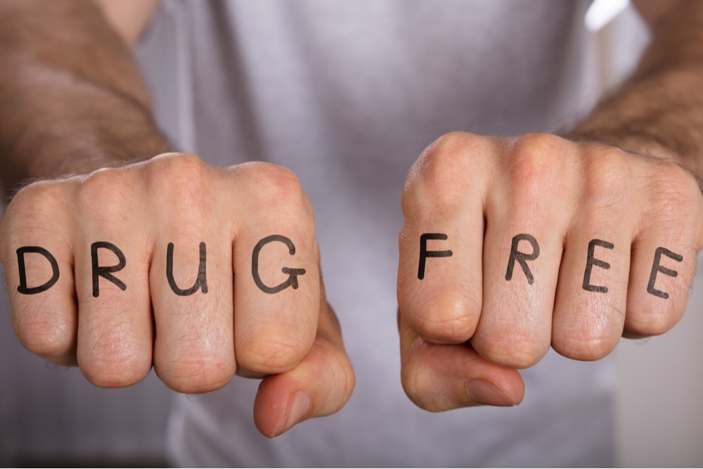 Close-up Of A Person Showing Drug Free Concept On Fist