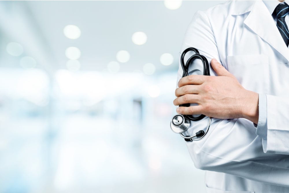 a doctor, holding a stethoscope